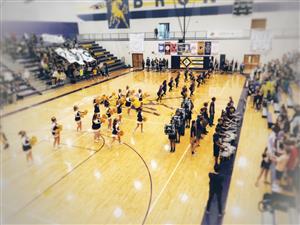 SHHS Cheerleaders, Band and Color Guard performing in the Gym at a school assembly